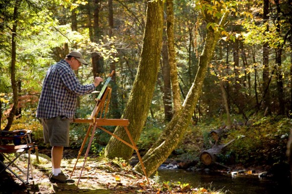 Mark Trew painting a scene on the Tellico River.